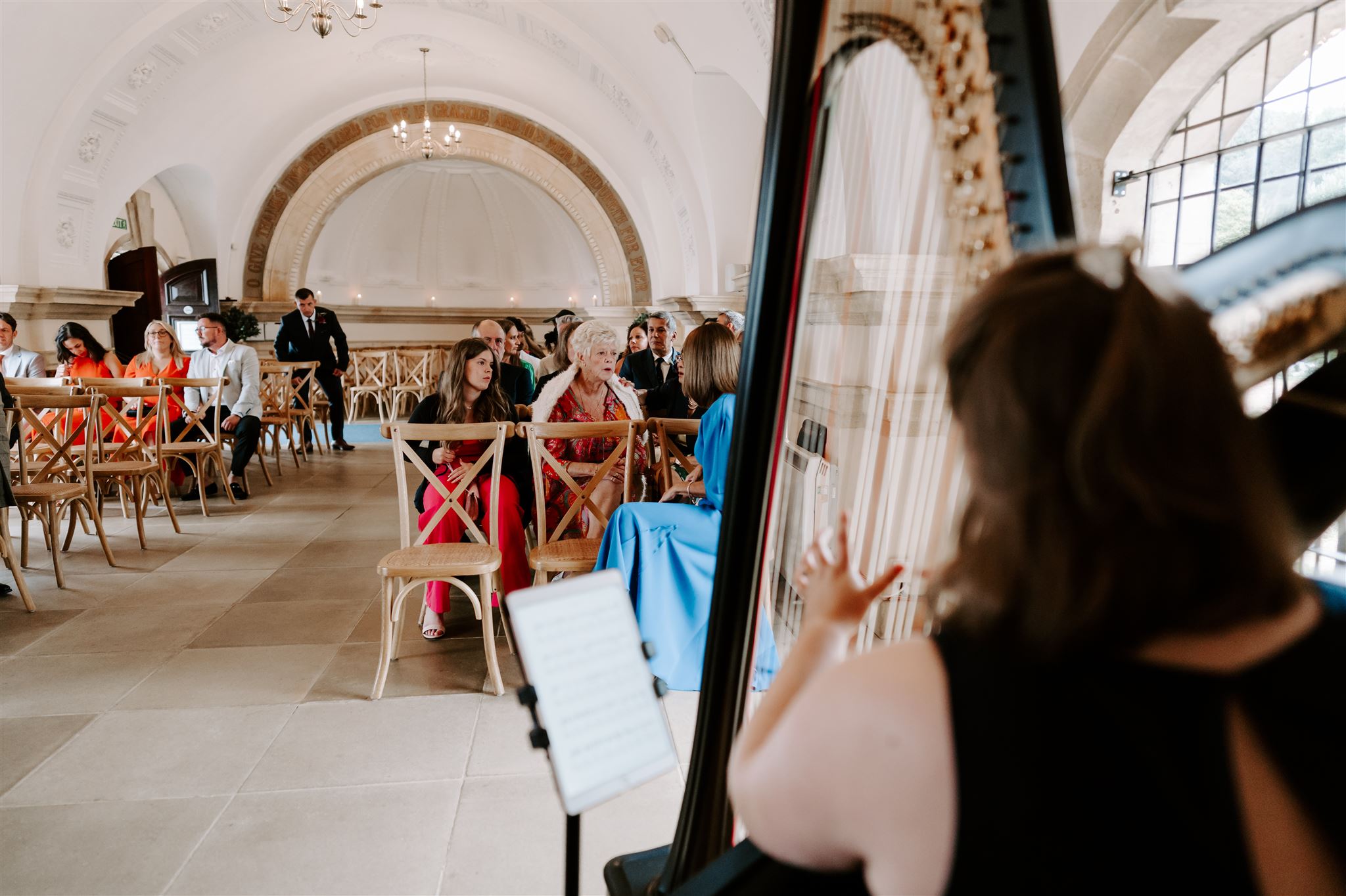 wedding harpist playing at a ceremony