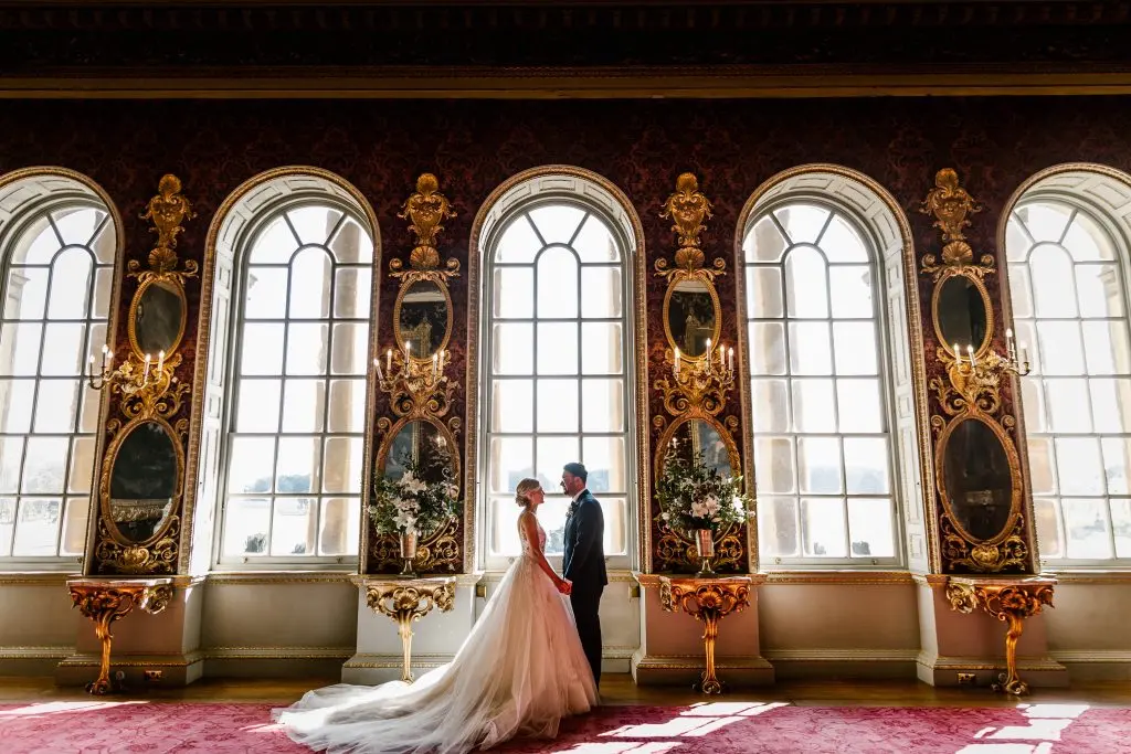Holkham Hall Wedding Venue with couple getting married